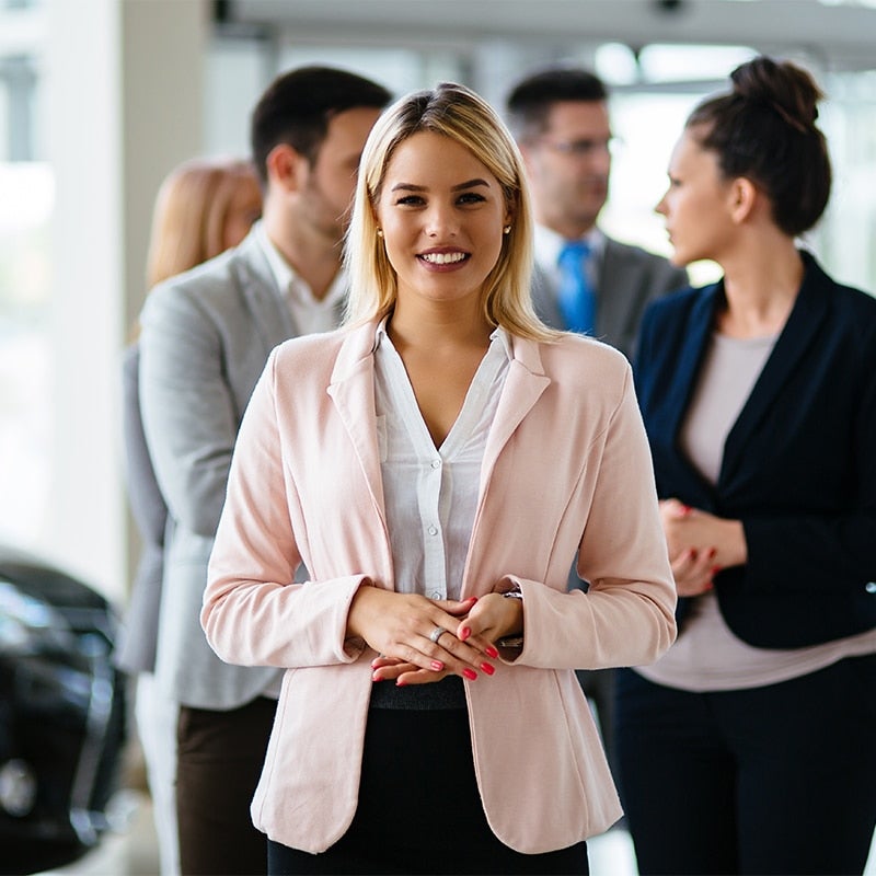 Friendly salesperson smiling in a warm welcome